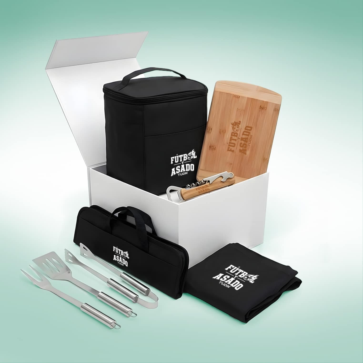an apron, a bamboo cutting board, a set of grilling tools with case, an insulated cooler bag, and a corkscrew bottle opener branded with Futbol y asado